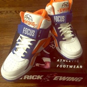Patrick Ewing’s orange blue and white sneakers